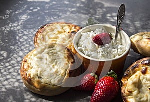 Appetizing round scones with quark. Top view photo of homemade sweet buns made of cottage cheese. Traditional Russian pastries.Â 